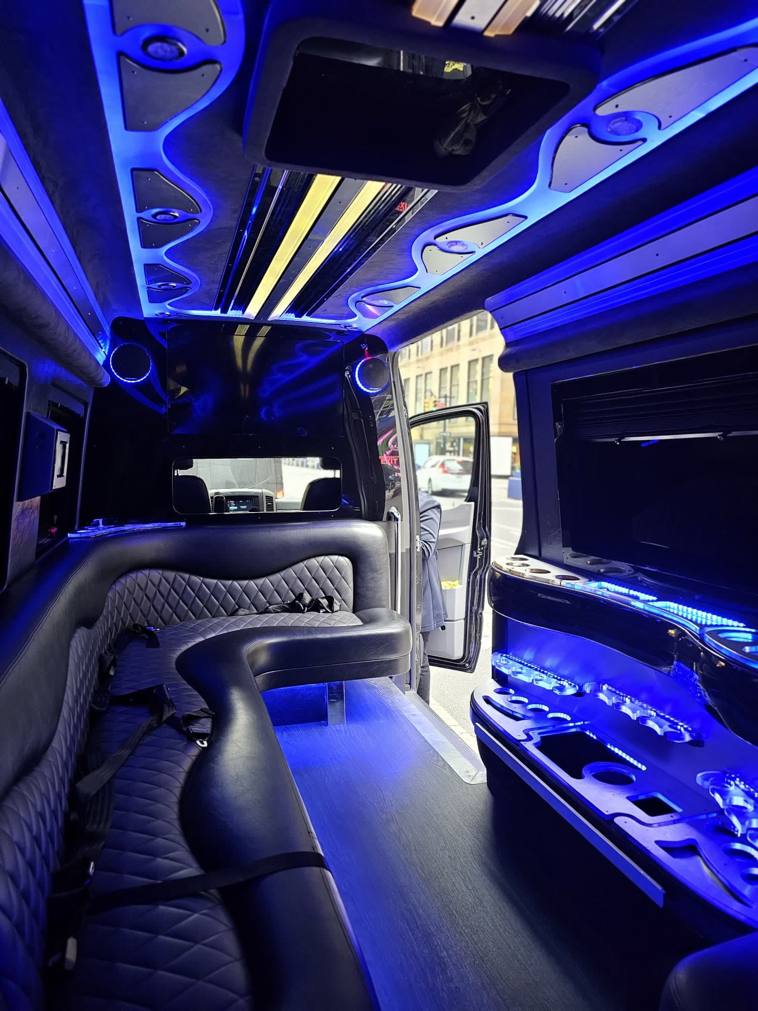 Limo Sprinter 760 dark luxury interior with quilted seating and ambient lighting